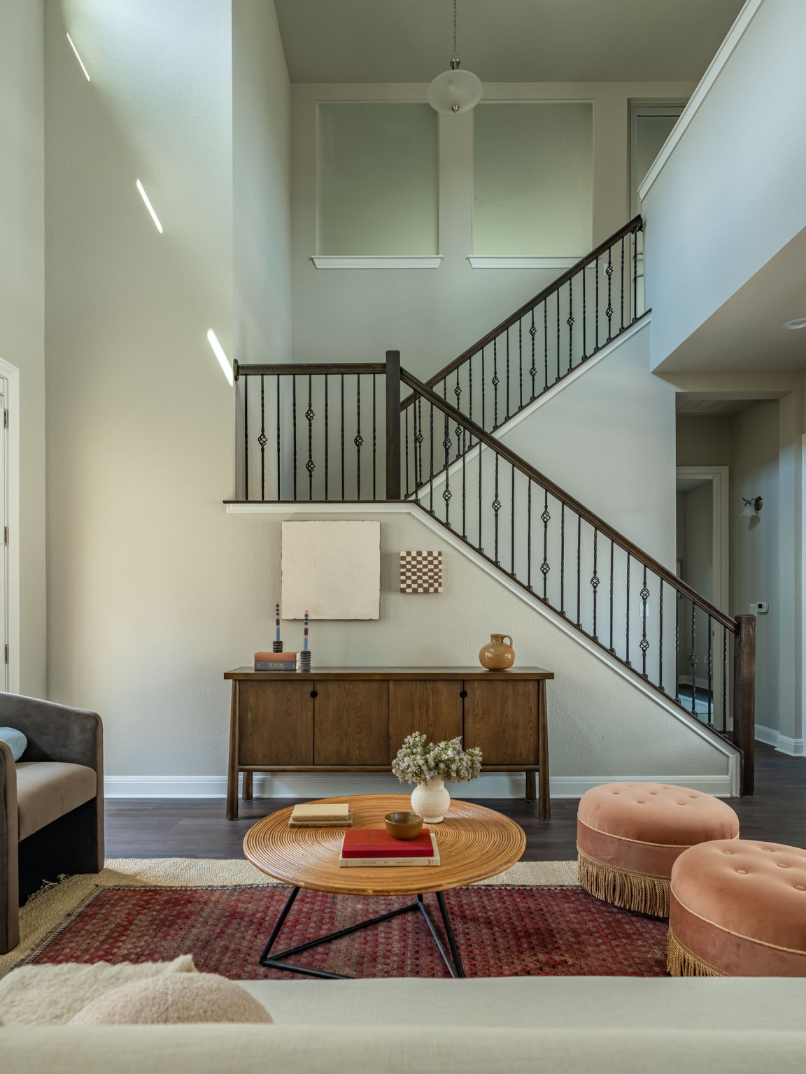 2516 Hopsack Mills Road Austin, TX 78748 - Photo 36 of 39 Two-story foyer featuring a staircase with wood-finish handrails and wrought iron balusters