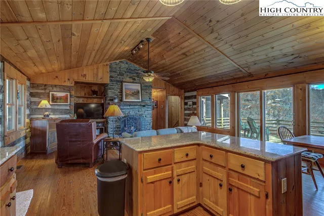 a view of a dining room with furniture and window