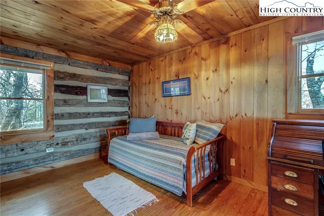 a view of balcony with chairs and wooden floor