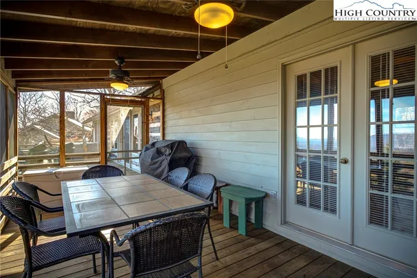 a view of a balcony dining area