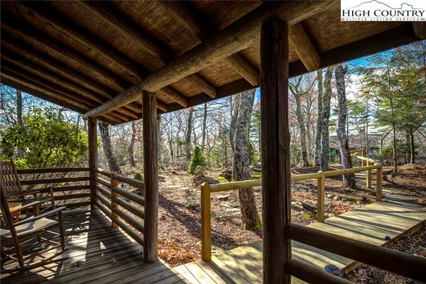 a view of a porch with wooden floor