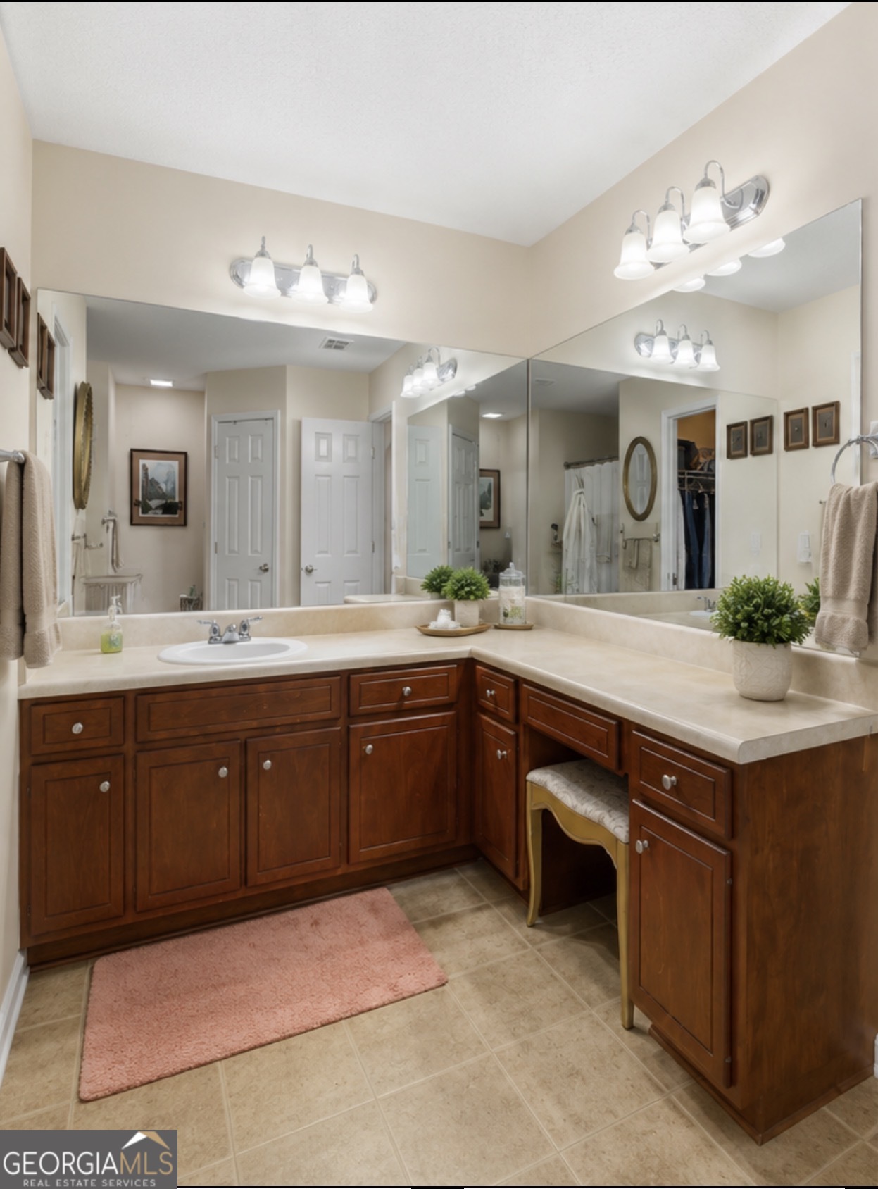 138 Brookfair Lane Leesburg, GA 31763 - Photo 20 of 30 a spacious bathroom with a granite countertop sink and a large mirror