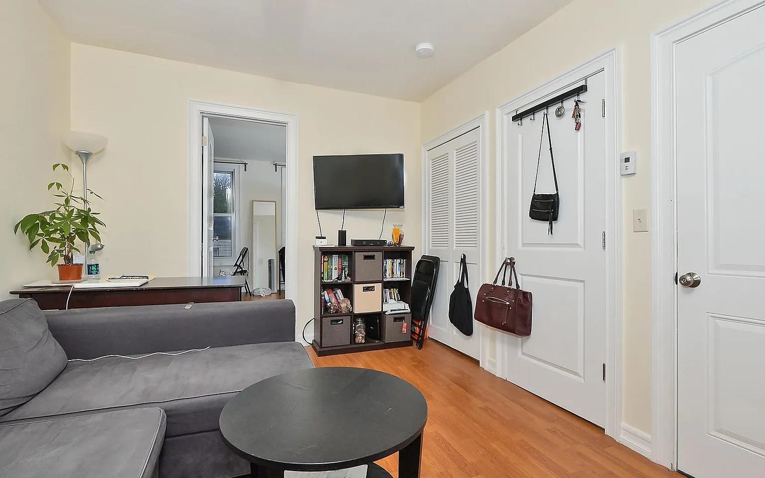 363 5th Street, Unit 2 Jersey City, NJ 07302 - Photo 3 of 7 a living room with furniture and a flat screen tv