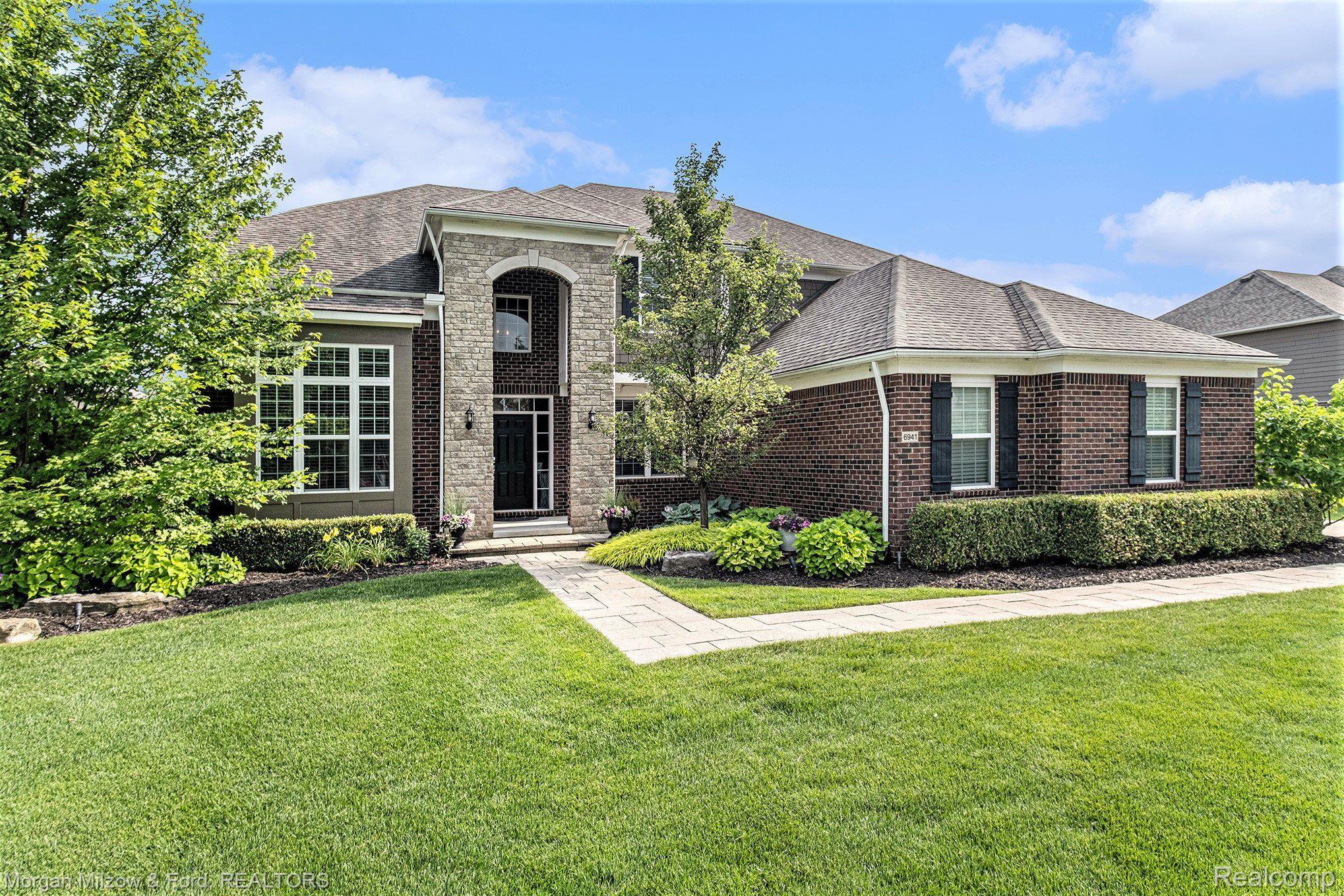 6941 Oakhurst Ridge Road Clarkston, MI 48348 - Photo 1 of 59 Commanding curb appeal!