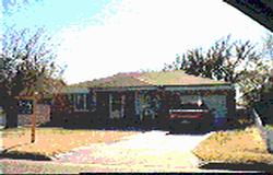 a view of house with yard