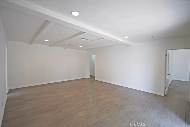 a view of a livingroom with a ceiling fan and window