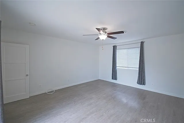 a bathroom with a granite countertop toilet sink and shower