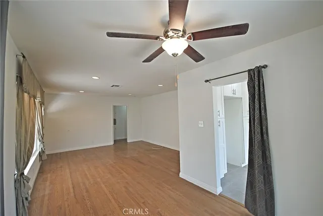 a kitchen with granite countertop a sink stove and refrigerator