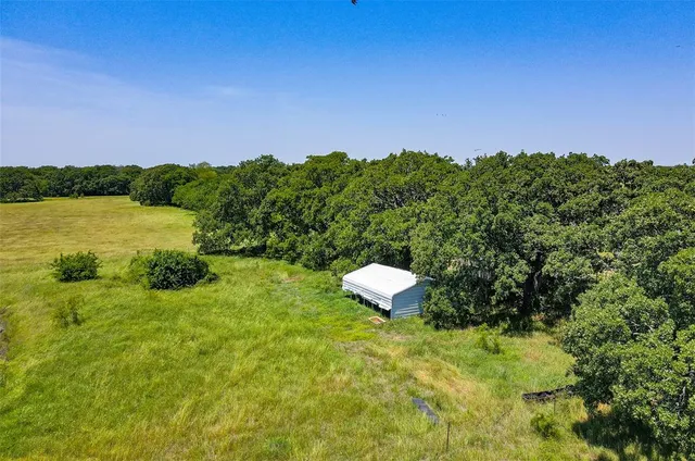 a view of a lake with a yard