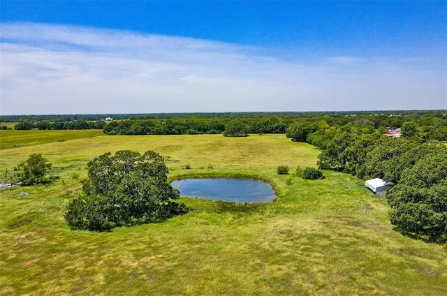 a view of a lake and a yard