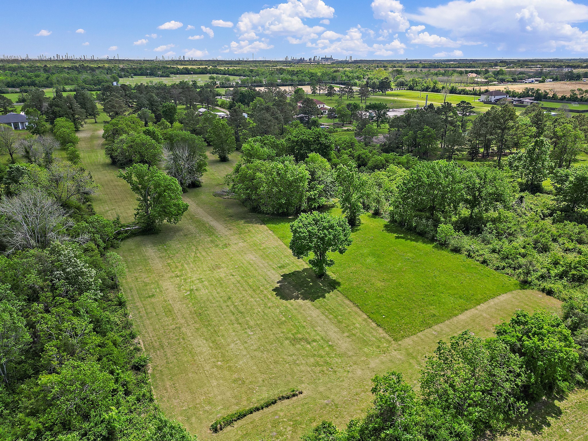 9915 North Main Street Baytown, TX 77521 - Photo 7 of 17 a view of a lush green outdoor space with a lake view