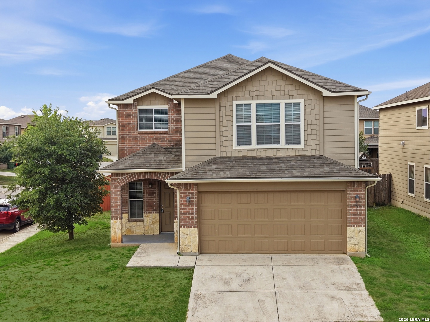 403 Walnut Crest Schertz, TX 78154 - Photo 1 of 30 a front view of a house with a garden and yard