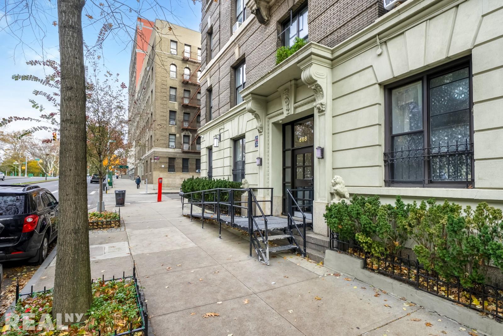 668 Riverside Drive, Unit 4G Manhattan, NY 11360 - Photo 10 of 11 a view of a brick building with many windows