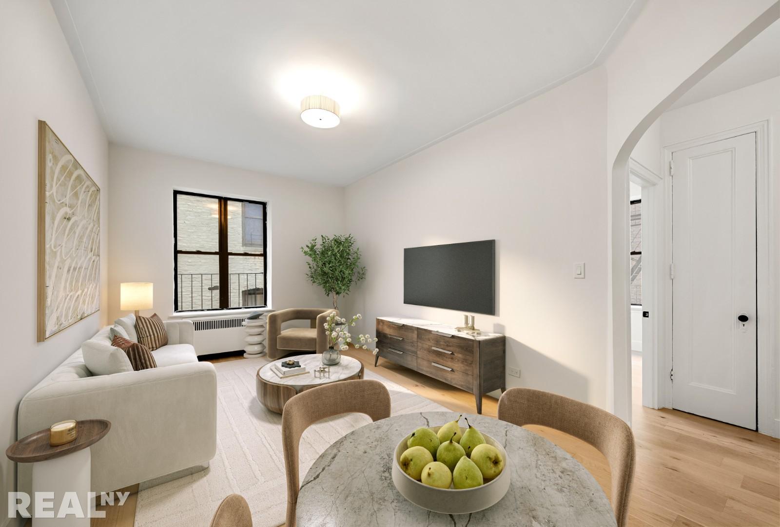 668 Riverside Drive, Unit 4G Manhattan, NY 11360 - Photo 1 of 11 a living room with furniture and a flat screen tv