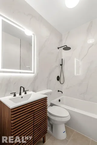 a bathroom with a sink a toilet and a bathtub