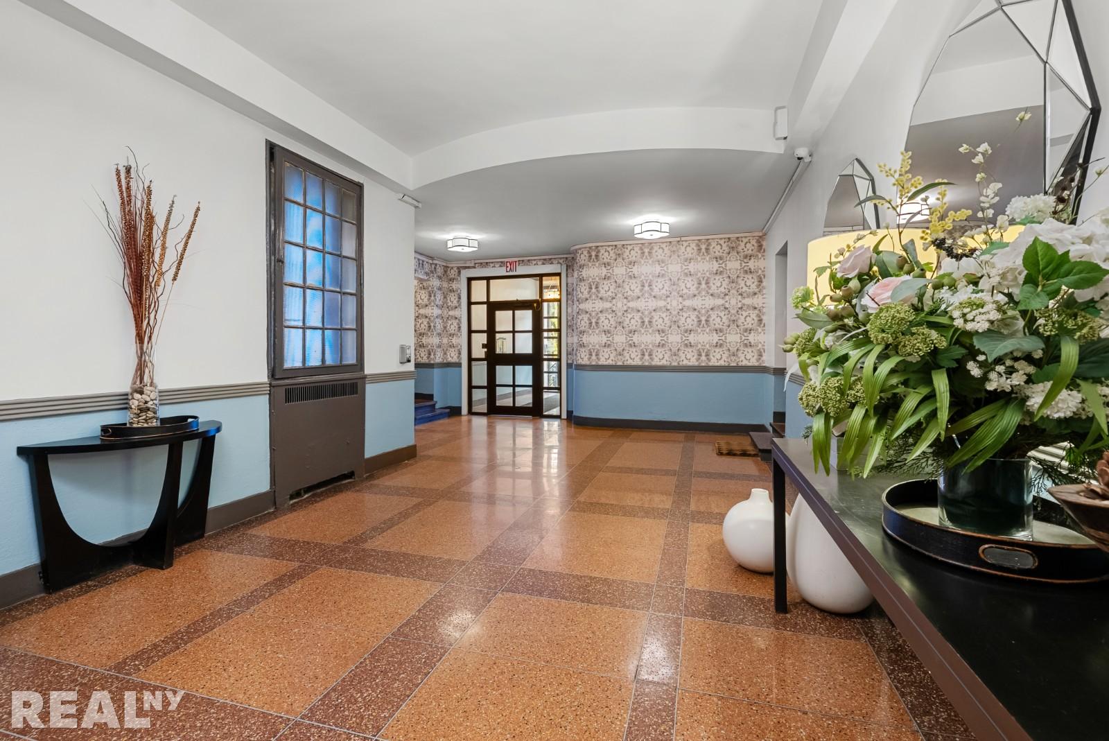 668 Riverside Drive, Unit 4G Manhattan, NY 11360 - Photo 9 of 11 a view of a living room and entryway