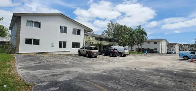 a view of a house with truck parked in front of a house