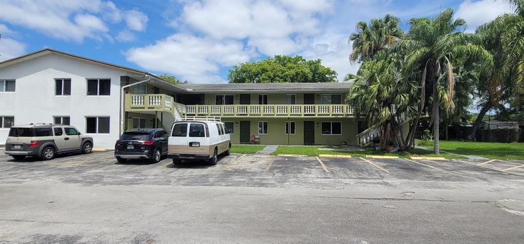 6601 Southwest 46th Street, Unit 203 Davie, FL 33314 - Photo 2 of 14 a car parked in front of white house