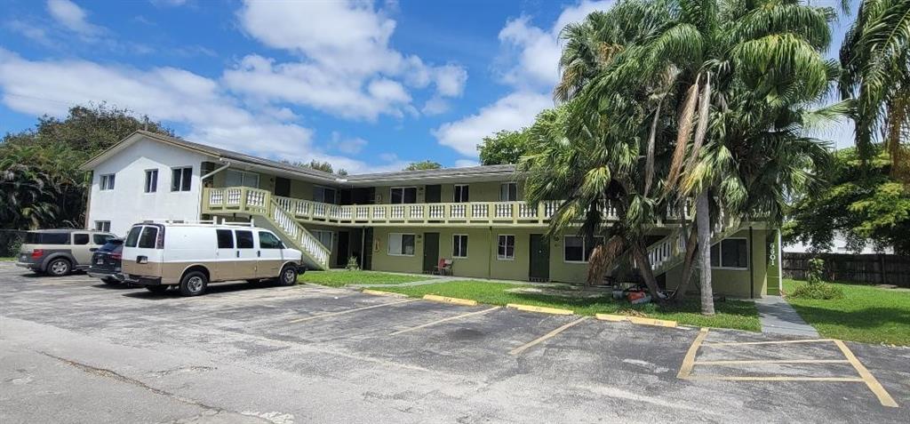 6601 Southwest 46th Street, Unit 203 Davie, FL 33314 - Photo 3 of 14 a car parked in front of white house