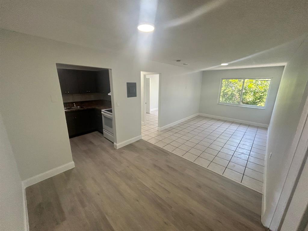6601 Southwest 46th Street, Unit 203 Davie, FL 33314 - Photo 5 of 14 wooden floor in an empty room and a window