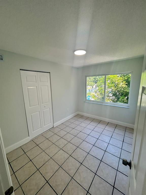 6601 Southwest 46th Street, Unit 203 Davie, FL 33314 - Photo 8 of 14 a view of an empty room and window