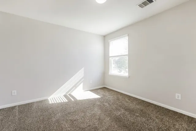 a view of an empty room and window