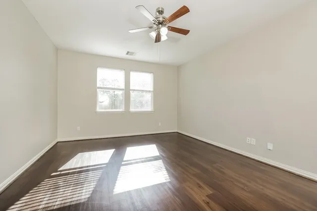 a view of a bathroom with a bathtub and shower