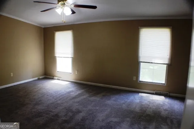 an empty room with a empty space and a window