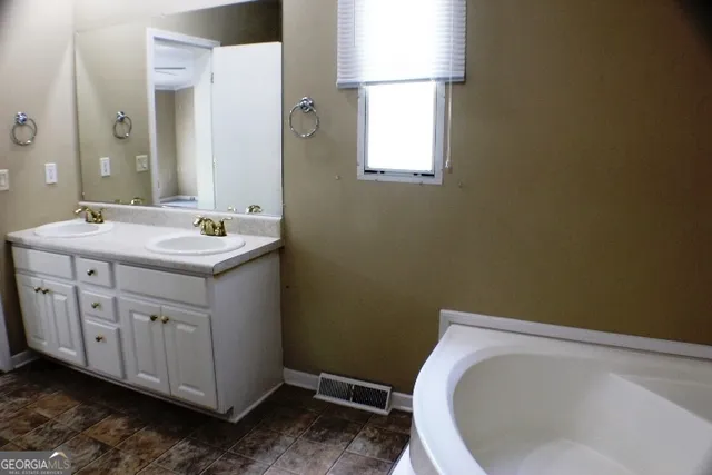 a bathroom with a sink and toilet