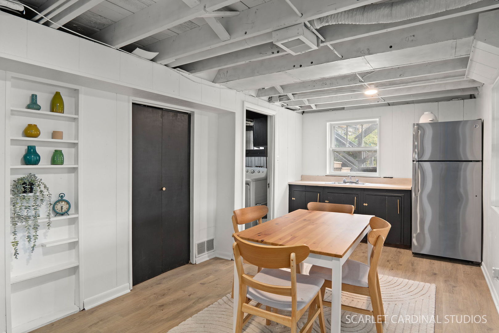 705 Spring Beach Way Cary, IL 60013 - Photo 13 of 32 a dining room with a wooden table and chairs