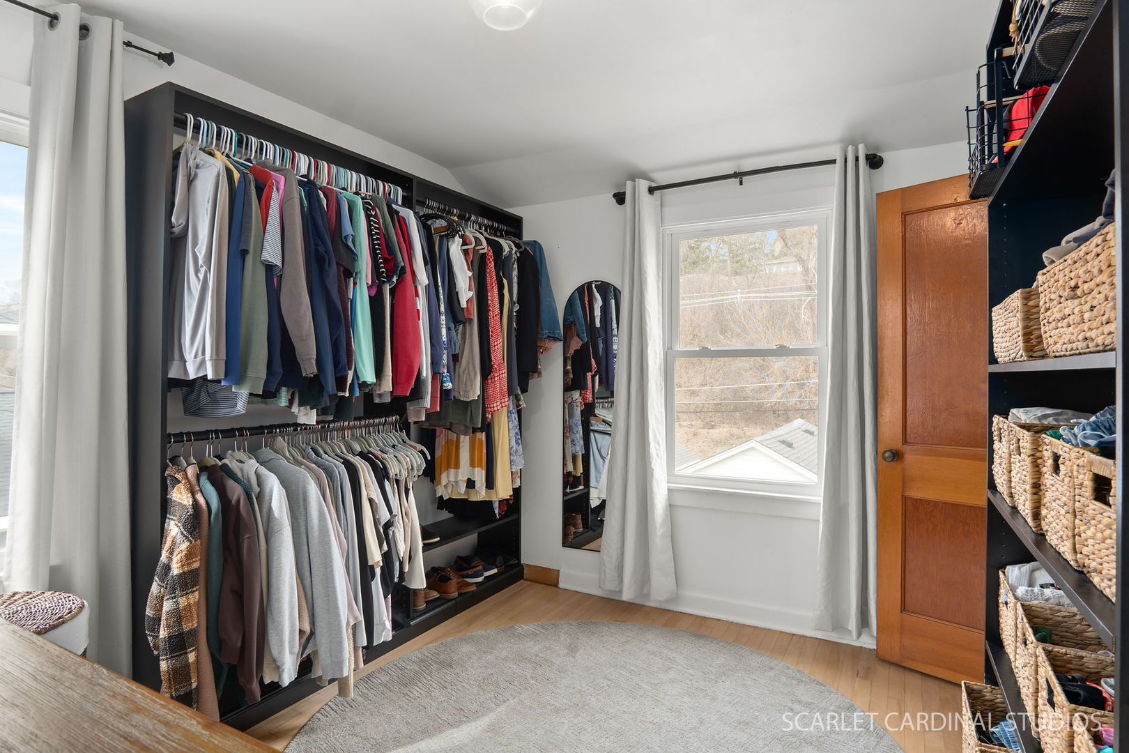 705 Spring Beach Way Cary, IL 60013 - Photo 9 of 32 a view of walk in closet with clothes and shoes