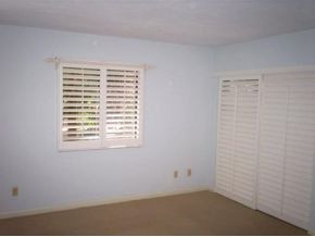 990 8th Street South, Unit 1 Naples, FL 34102 - Photo 3 of 10 an empty room with a window