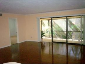 990 8th Street South, Unit 1 Naples, FL 34102 - Photo 5 of 10 a view of an empty room and window
