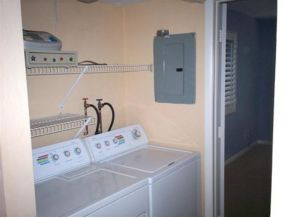 990 8th Street South, Unit 1 Naples, FL 34102 - Photo 8 of 10 a close view of a sink a washer and dryer