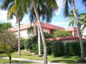 990 8th Street South, Unit 1 Naples, FL 34102 - Photo 10 of 10 a view of a yard with a palm trees