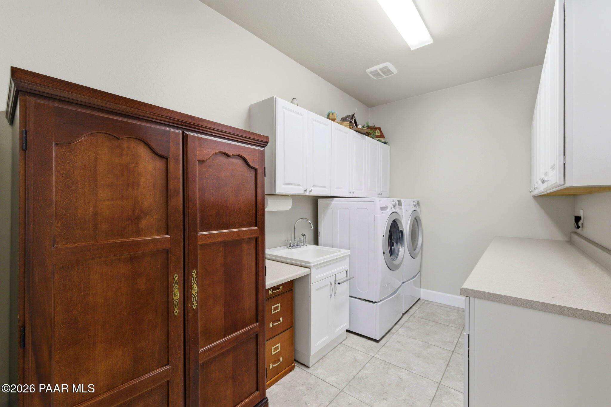 8510 Pepperbox Road Prescott Valley, AZ 86315 - Photo 23 of 44 Laundry w/ Cabinetry and Sink Base