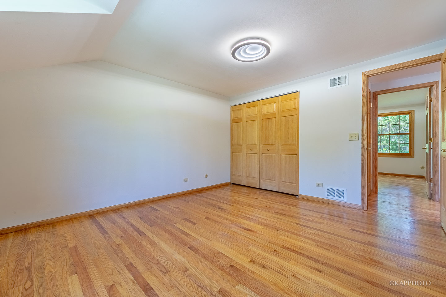 1553 Aztec Circle Naperville, IL 60563 - Photo 21 of 45 an empty room with wooden floor and windows