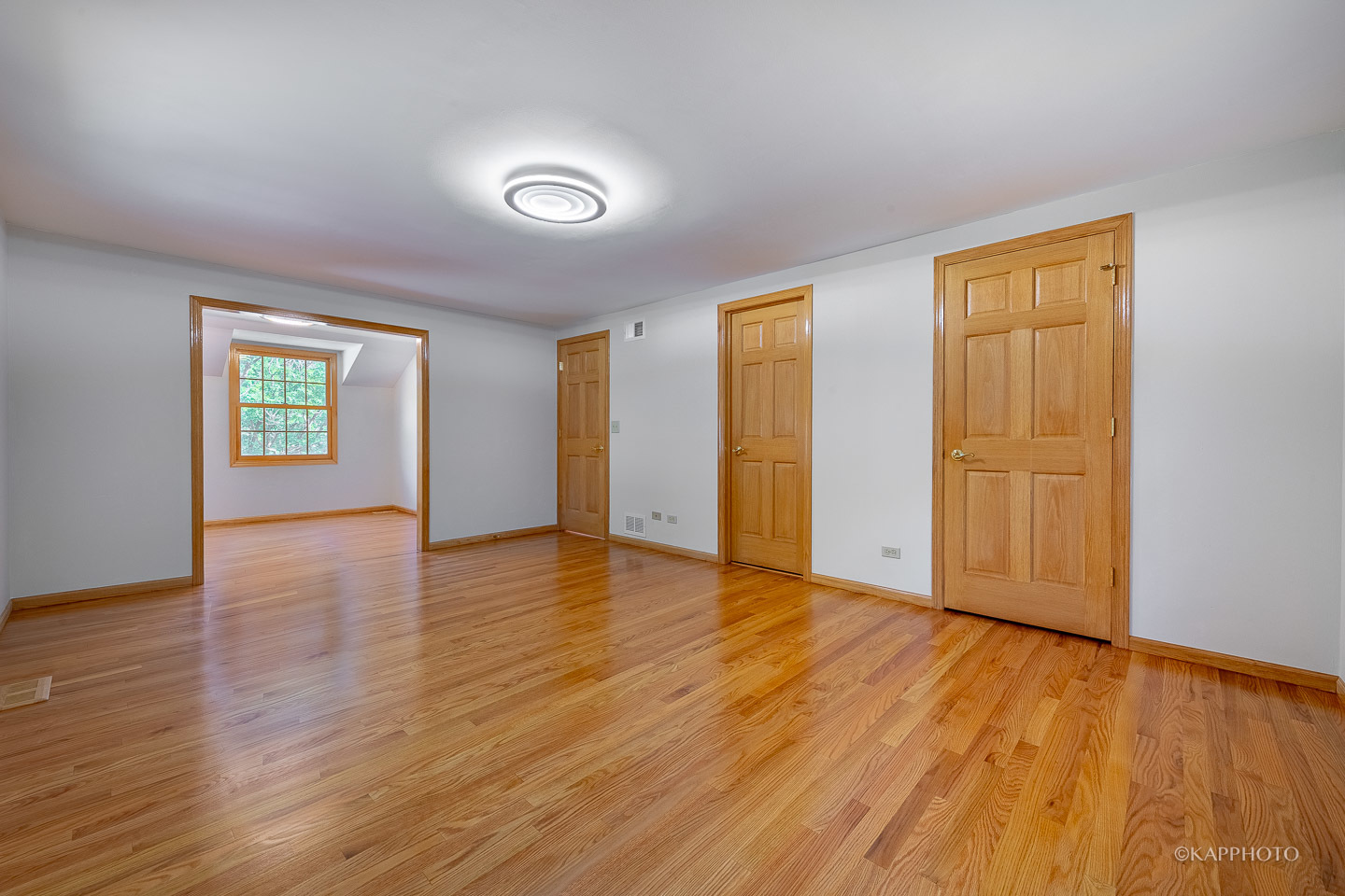 1553 Aztec Circle Naperville, IL 60563 - Photo 27 of 45 an empty room with wooden floor and windows