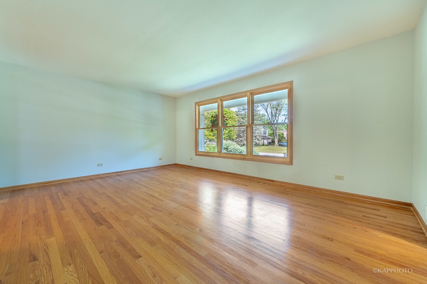 1553 Aztec Circle Naperville, IL 60563 - Photo 5 of 45 an empty room with wooden floor and windows