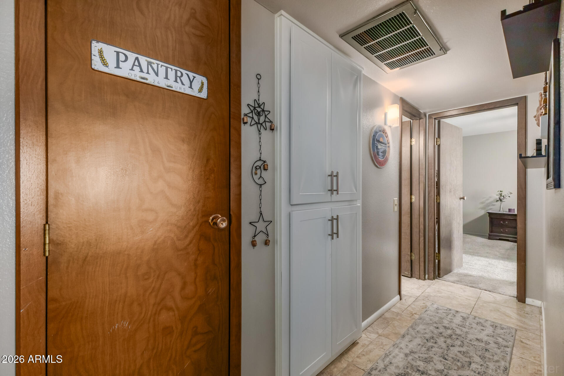 9845 West Royal Ridge Drive Sun City, AZ 85351 - Photo 16 of 28 a view of a hallway
