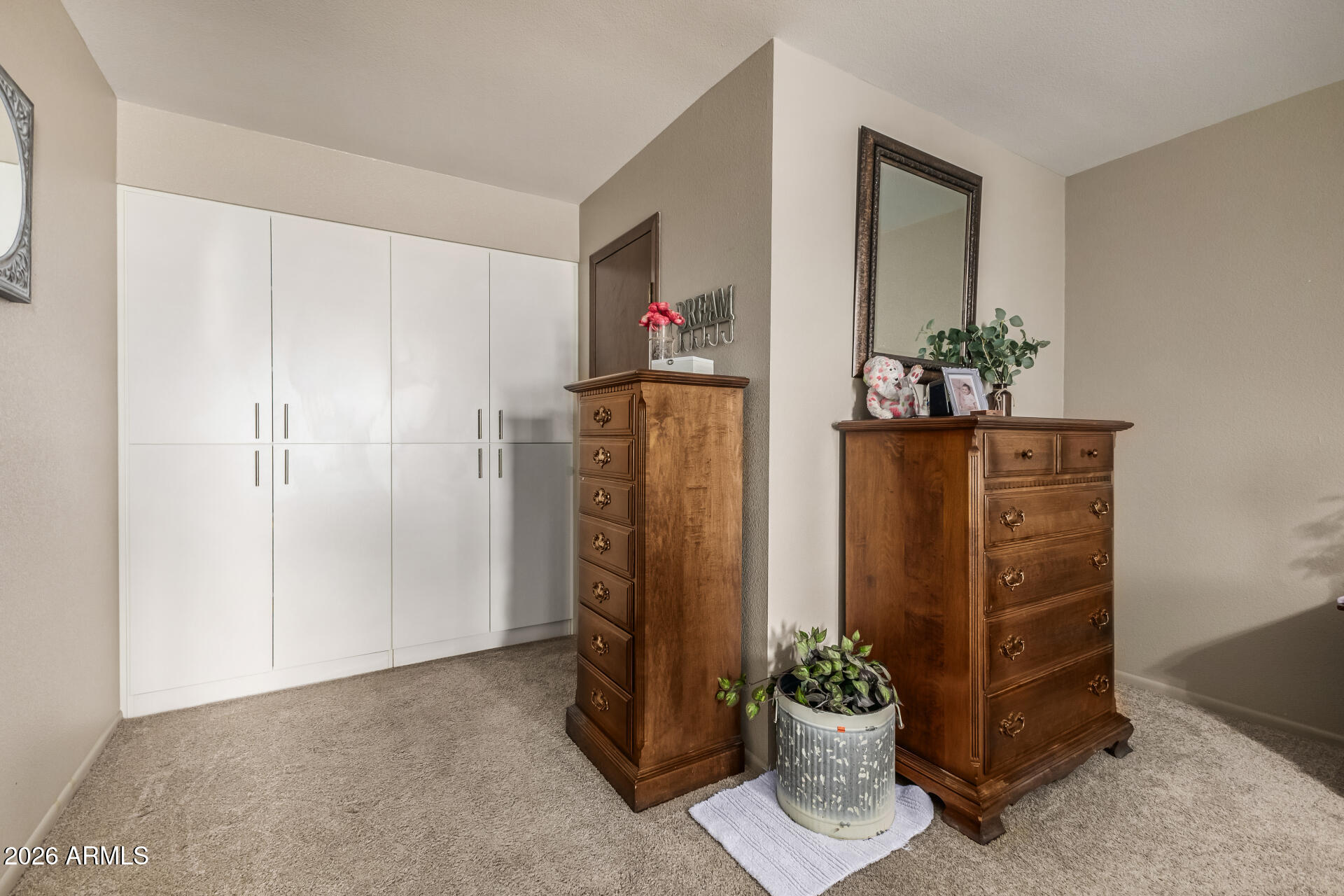 9845 West Royal Ridge Drive Sun City, AZ 85351 - Photo 20 of 28 a dining room with furniture and a potted plant