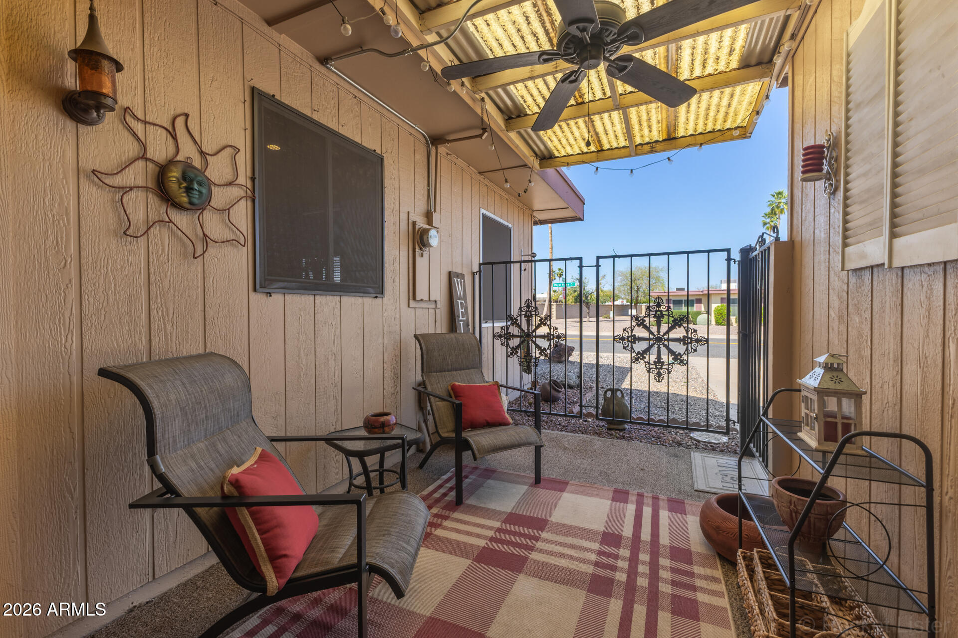 9845 West Royal Ridge Drive Sun City, AZ 85351 - Photo 27 of 28 a building outdoor space with patio furniture