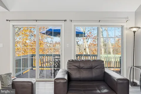 a living room with furniture fireplace and flat screen tv