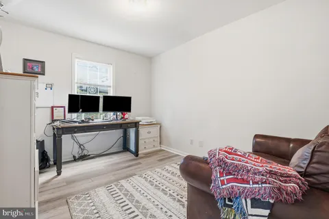 a bathroom with a toilet sink and shower