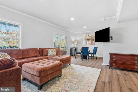 an aerial view of a house with a garden and lake view