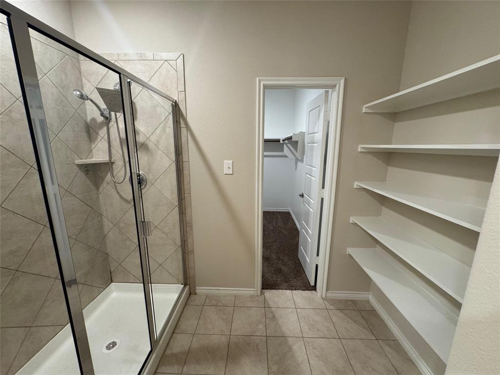 940 Azure Lane Celina, TX 75009 - Photo 20 of 26 a view of an empty walk in closet