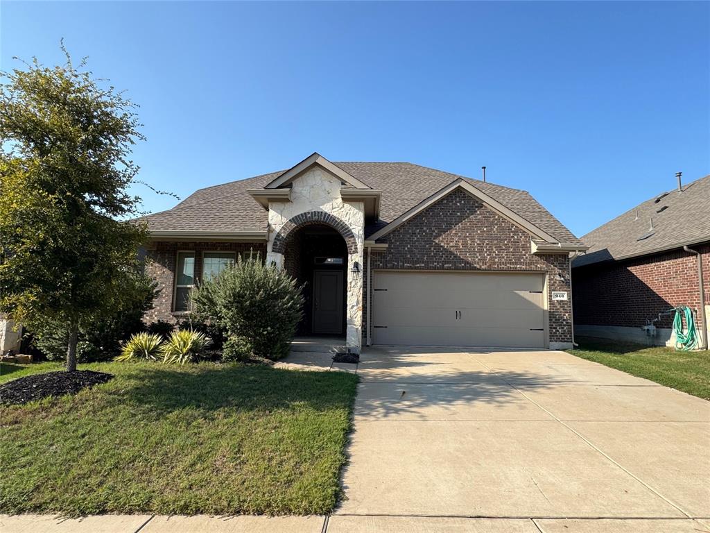 940 Azure Lane Celina, TX 75009 - Photo 2 of 26 a front view of a house with garden