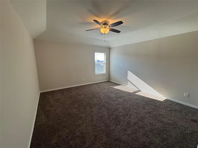 a view of hallway with stairs and wooden floor