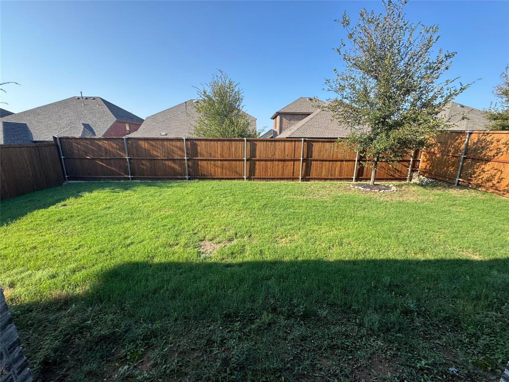 940 Azure Lane Celina, TX 75009 - Photo 5 of 26 a view of a backyard