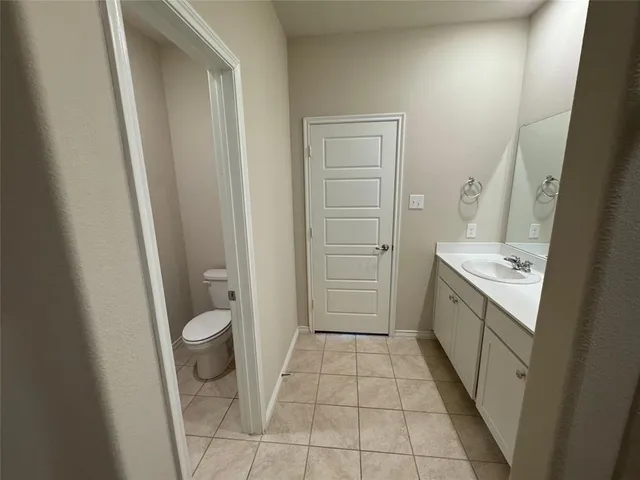 a bathroom with a sink a toilet and a shower
